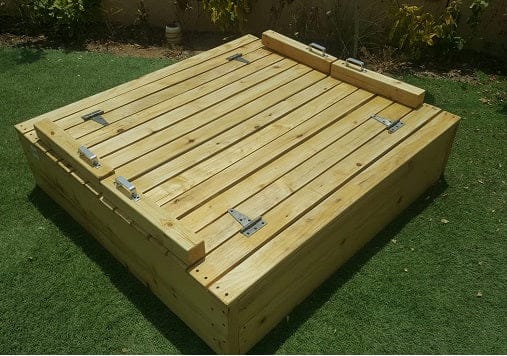 Hand built wooden sandpit with folding benches/lid