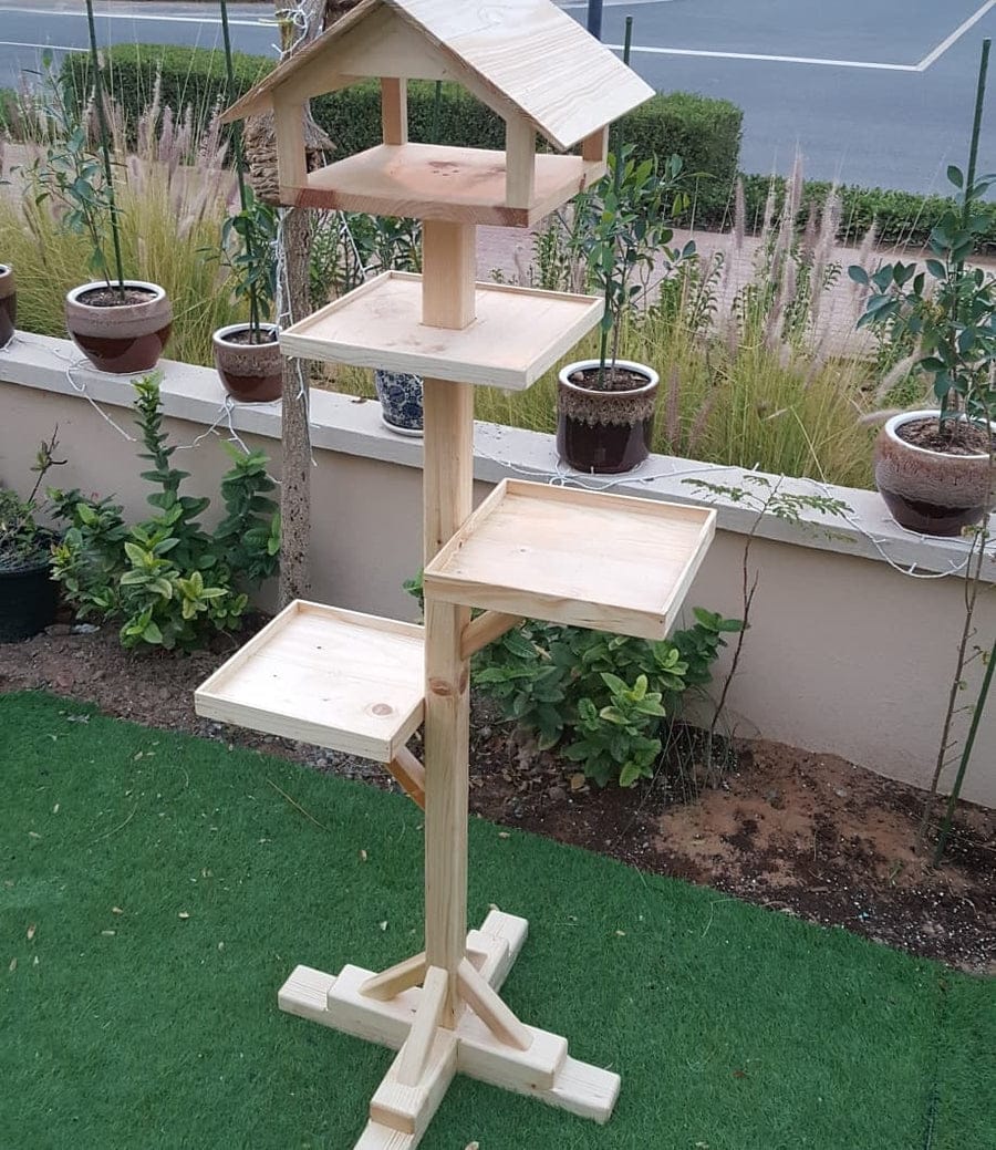 Beautiful wooden bird feeder with house