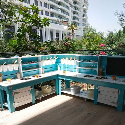 Hand built wooden mud kitchen for endless fun