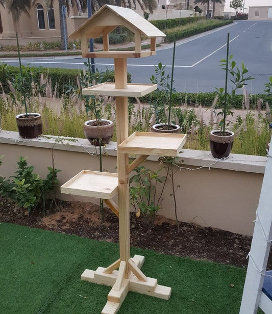 Beautiful wooden bird feeder with house